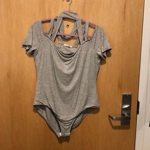 Bodysuit with cold shoulder and caging